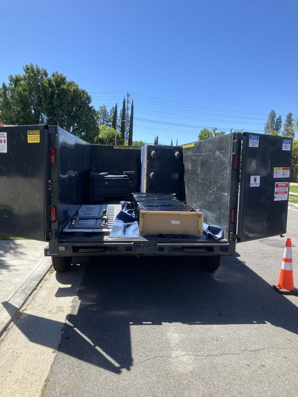 Padded and wrapped furniture loaded carefully for a commercial move in North Hollywood