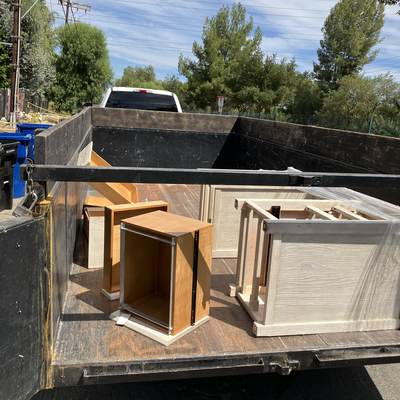 Furniture and cabinet boxes loaded for removal in North Hollywood